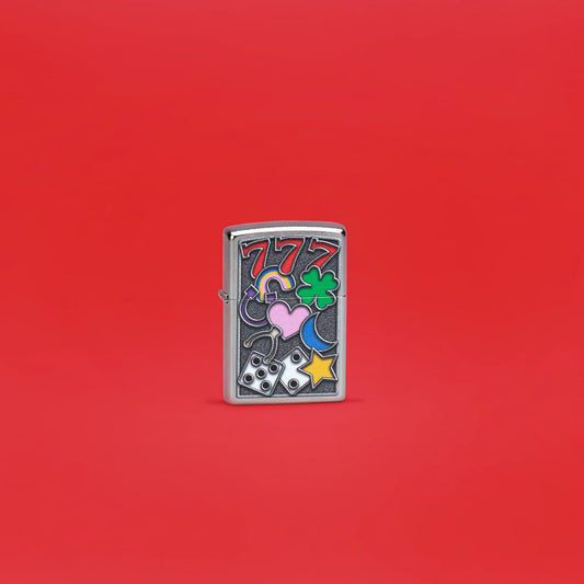 Lifestyle image of Zippo All Luck Design Street Chrome Windproof Lighter standing in a red scene.