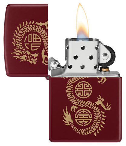 Zippo Lucky Dragon Design Merlot Windproof Lighter with its lid open and lit.