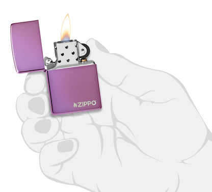 Classic High Polish Purple Windproof Lighter with Zippo Logo lit in hand.