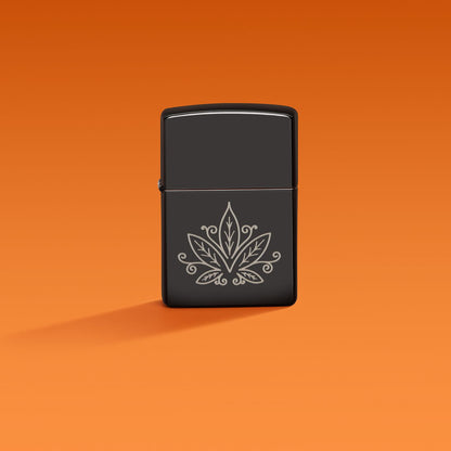 Lifestyle image of Zippo Cannabis Design High Polish Black Windproof Lighter on an orange ombre background.