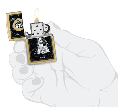 Zippo Death Card Desig Street Brass Windproof Lighter lit in hand.