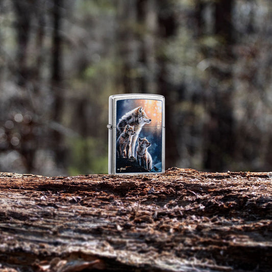 Lifestyle image of Zippo Mazzi® Wolf Pack Design Street Chrome Windproof Lighter standing on a tree trunk with the forest as the background, showing the front of the lighter. 

